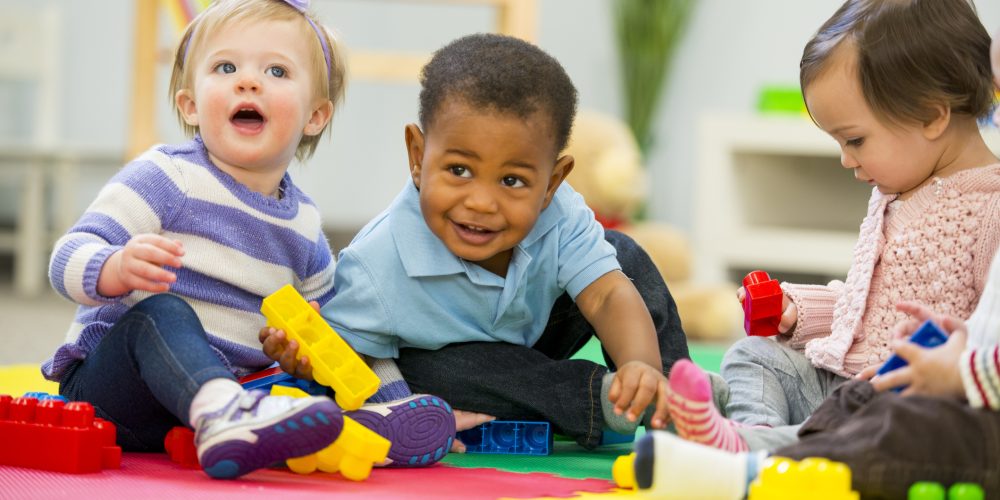Diverse group of babies playing.